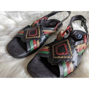 Black Dr Scholl's Sandals with red, green and tan accents.